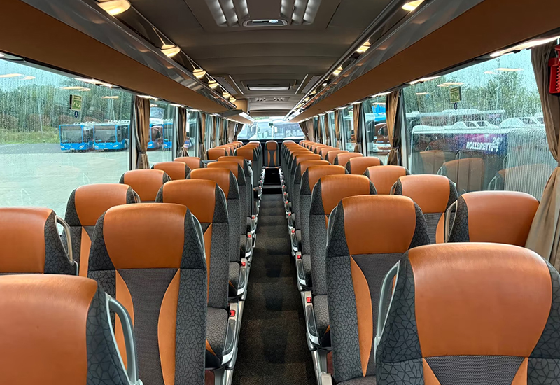 Setra coach cabin with orange and gray seats